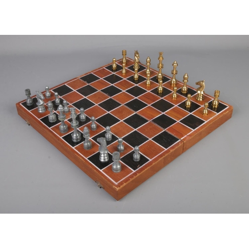 284 - Wooden chess board with pewter and brass pieces