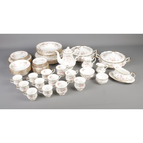 327 - A large collection of Paragon Victoriana Rose china, including 2 lidded tureens, tea pot and milk ju... 