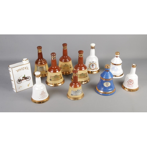 337 - A Collection of wade bell shaped whisky decanters including commemorative 60th and 75th birthday edi... 