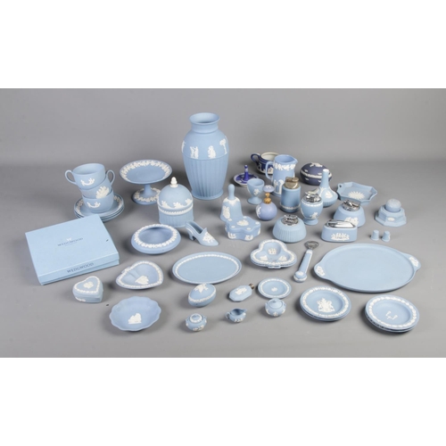 341 - A large collection of Wedgewood Jasperware to include tea cups and saucers, table lighters and cake ... 