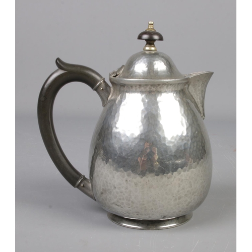 553 - A Liberty and Co Tudric hammered pewter water jug