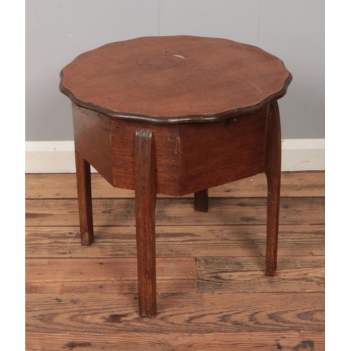 578 - A mid 20th century oak workbox in the Art Deco style produced by A Morco.

H48cm
D50cm