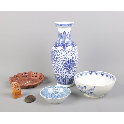 318 - A collection of oriental ware including blue and white ceramics, seal and carved dish.