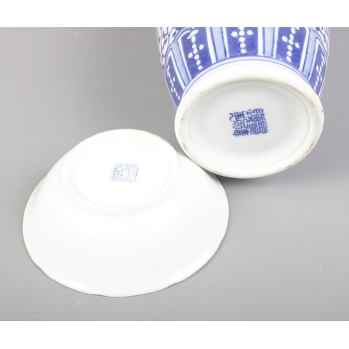 318 - A collection of oriental ware including blue and white ceramics, seal and carved dish.