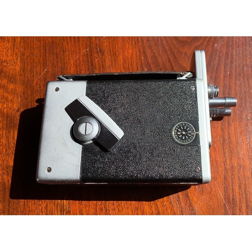 273 - A Bell & Howell 16mm Cine Camera in original leather carry case with accessories such as manual and ... 