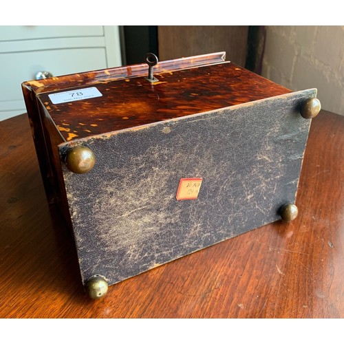 78 - A 19th century tortoise shell tea caddy raised on four bun feet. Having silvered banding and monogra... 