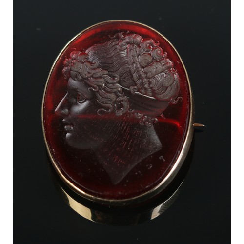 119 - After Filippo Rega, a paste intaglio brooch with portrait of Emma, Lady Hamilton, in 15ct gold mount... 