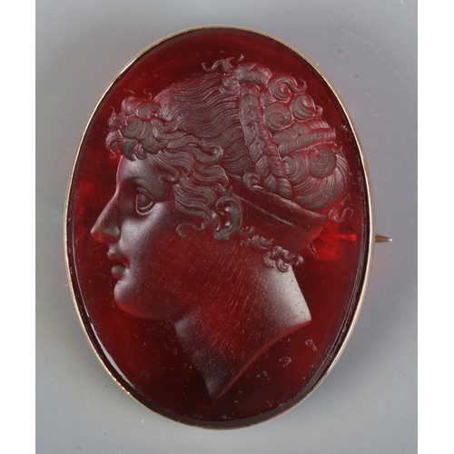 119 - After Filippo Rega, a paste intaglio brooch with portrait of Emma, Lady Hamilton, in 15ct gold mount... 