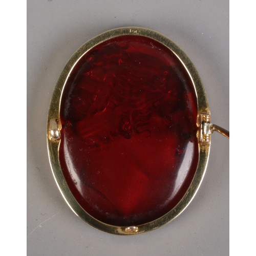 119 - After Filippo Rega, a paste intaglio brooch with portrait of Emma, Lady Hamilton, in 15ct gold mount... 