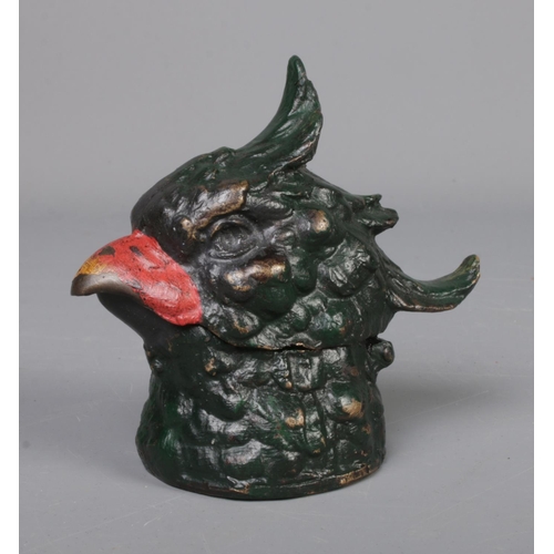 140 - A cold painted bronze inkwell in the form of a bird head, marked 