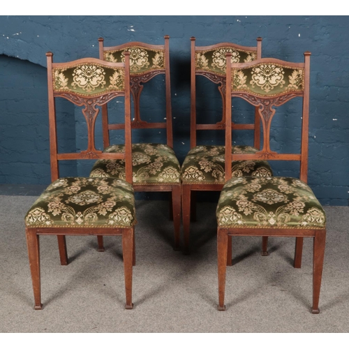 539 - Four velvet upholstered dining chairs featuring tree of life style design to back support.