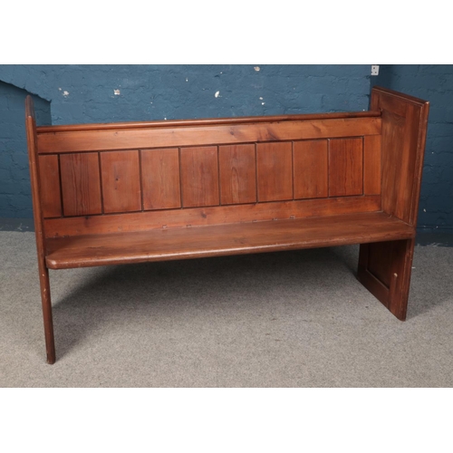 548 - A pine church pew. Approx. dimensions 153cm x 97cm x 46.5cm.