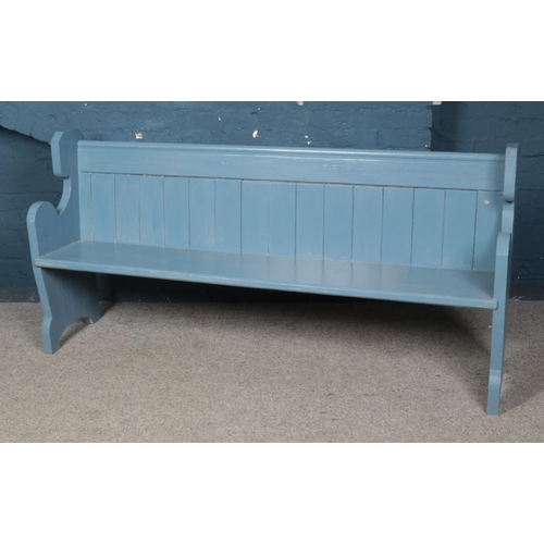 550 - A blue painted church pew. Approx. dimensions 186cm x 89cm x 41cm.