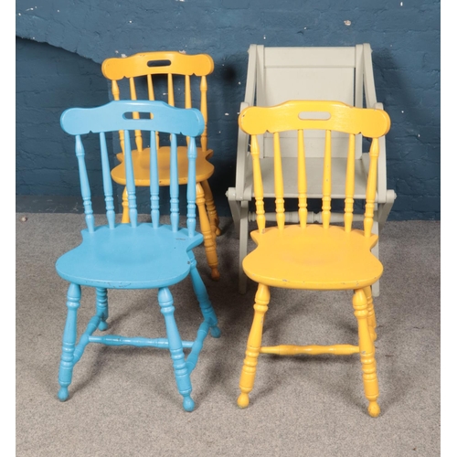 552 - Four painted chairs including three dining examples.