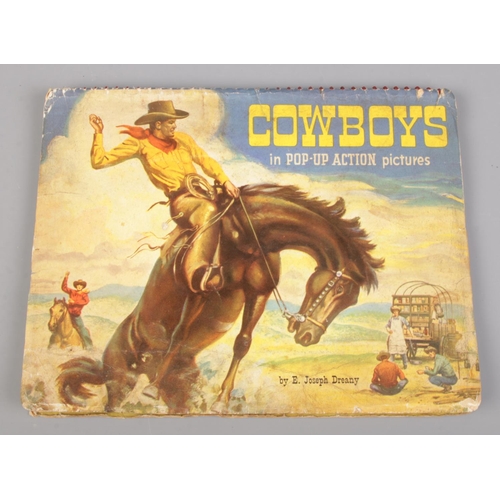 561 - Cowboys; in pop-up action pictures, by E. Joseph Dreany, 1951.