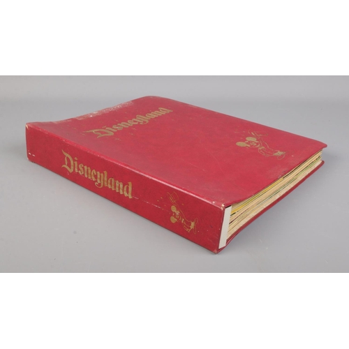 564 - Disneyland magazine; volumes 1-26 in branded folder.