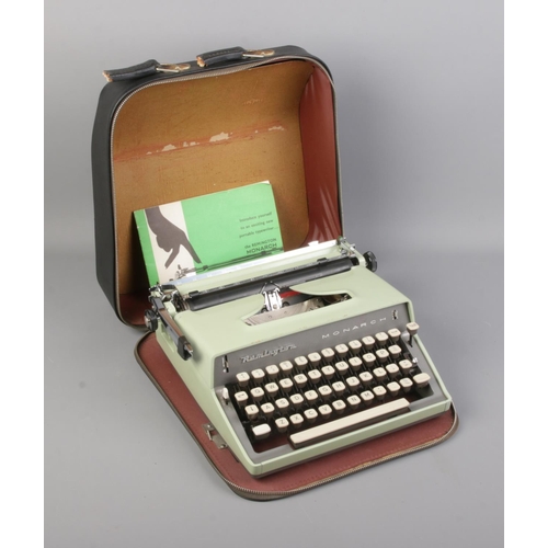 113 - Remington Monarch type writer in travel  case and manual.