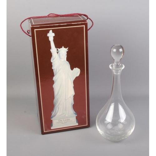 115 - A boxed De Luze Grand Cognac decanter of the statue of liberty along with other glass Bartin & Gusti... 