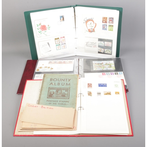 116 - Three albums of stamps including first day covers, presentation packs and loose examples.