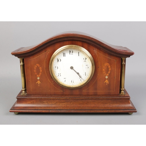 119 - A Buren mantel clock featuring mother of pearl inlaid decoration.