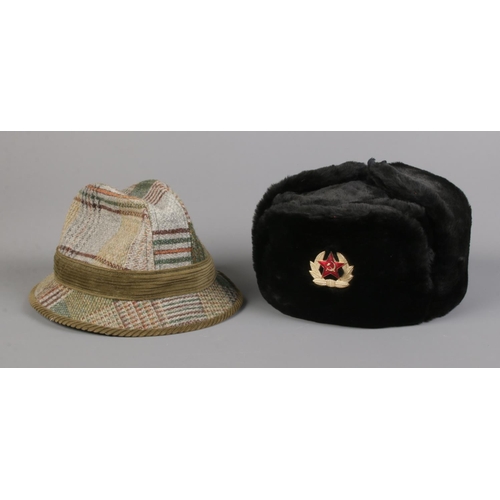 12 - A Soviet army Ushanka hat, labelled 62 to the inside, together with a Mybro tweed example.