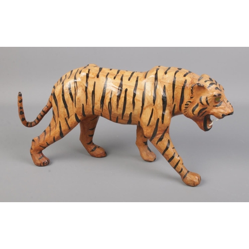 128 - A vintage leather wrapped tiger.

36cm long