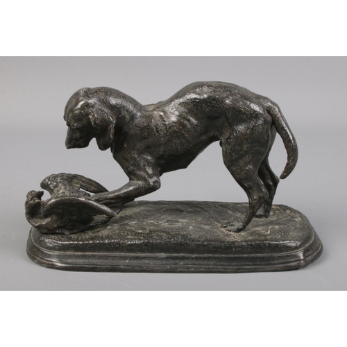 130 - A cast spelter figure of a hunting dog with duck.

16cm long