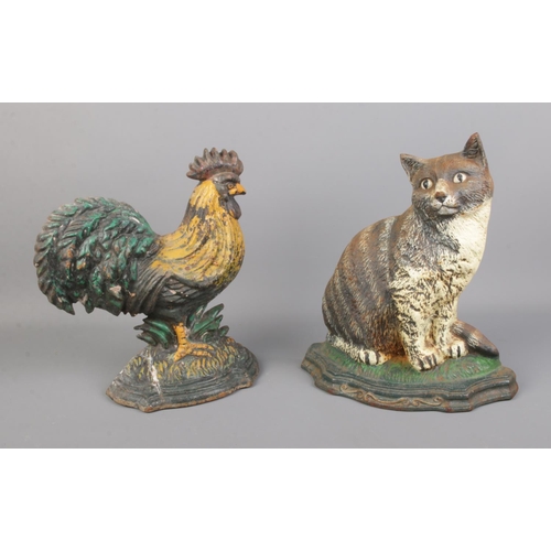 137 - Two cast iron door stops in the form of a cockerel and cat.