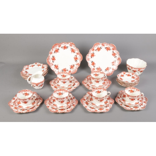 23 - An Edwardian Paragon China tea service stamped 1928 to underside. Includes cake plates, milk jug, su... 