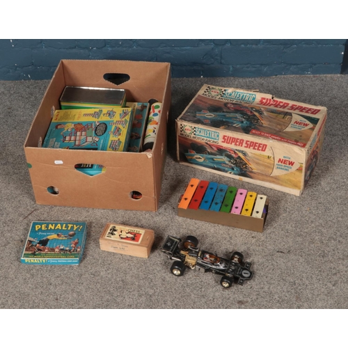 186 - A box of vintage children's toys and games including Scalextric Super Speed, Xylophone, miniature ch... 