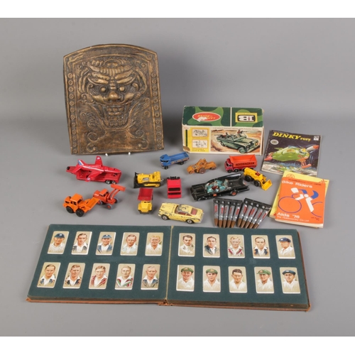 188 - A quantity of collectables including diecast vehicles, Will's Cigarette album and wall plaque depict... 