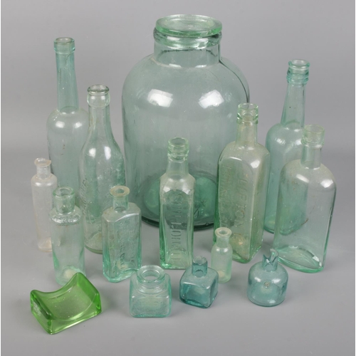 192 - A collection of mostly glass bottles. Includes advertising examples, Lillicraps Hone, etc.