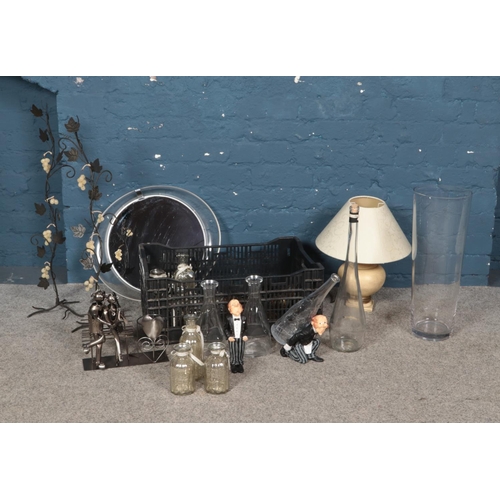 200 - A collection of glass bottles and vases with other items such as mirror, butler figures and more.