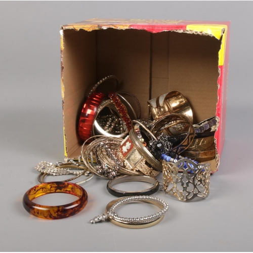 205 - A collection of costume jewellery bracelets and bangles.