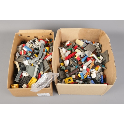 223 - Two small boxes of loose Lego pieces.