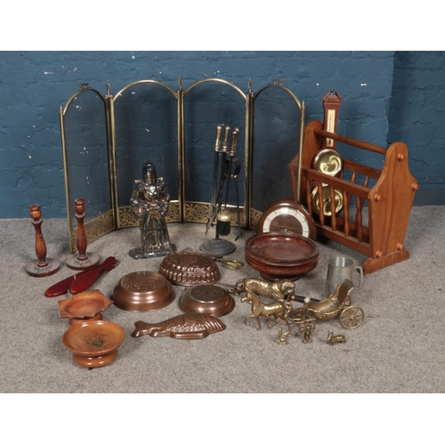 236 - A box of wooden and metalwares to include fireplace accessories, brass decorative pieces and wooden ... 