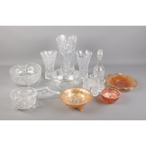 247 - A collection of cut glassware including vases and bowls.