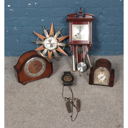 249 - A collection of clocks featuring a Highland pendulum wall clock, The Alexander Clark Co mantel clock... 