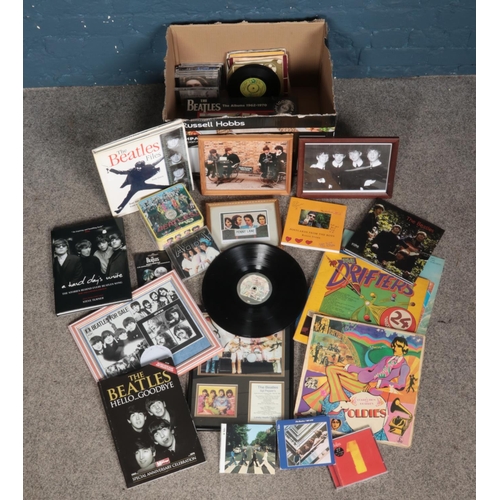 254 - A quantity of mostly The Beatles collectables. Includes Hasbro Sgt Pepper double sided jigsaw, photo... 