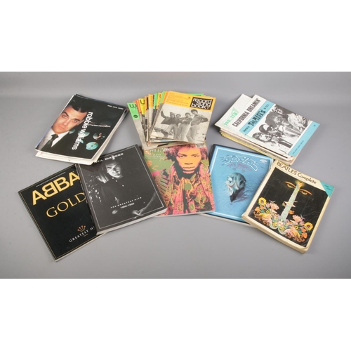 261 - A collection sheet music books including Beatles complete guitar edition, Jimi Hendrix, Abba and Eag... 