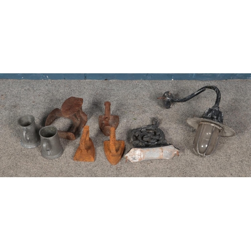 271 - A collection of metalwares including irons, outdoor light fitting, pewter tankards, etc.