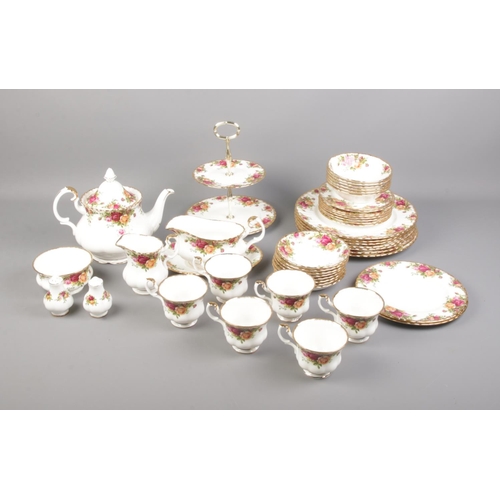 280 - A Royal Albert Old Country Roses tea set including cake stand, tea pot, serving plates and more.