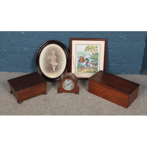 282 - A box of miscellaneous to include mantel clock, framed cross stitch, two boxes, etc.