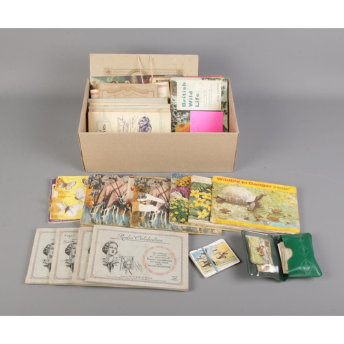 37 - A box of cigarette and tea card albums, some complete, including Kings & Queens of England, British ... 