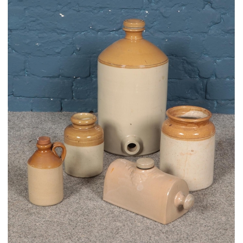 40 - A collection of stoneware flagons, jars and bed warmer.