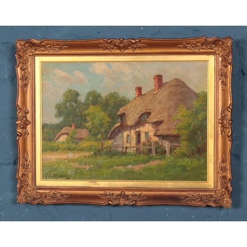 299 - Sidney Gardner (1869-1957) gilt framed oil on board depicting thatched cottages. Approx. dimensions ... 