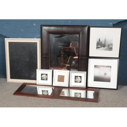 301 - A quantity of mirrors, frames and prints. To include large faux leather example.