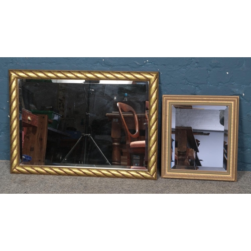 308 - Two gilt framed bevel edged mirrors. Approx. dimensions of largest example 57.5cm x 81.5cm.