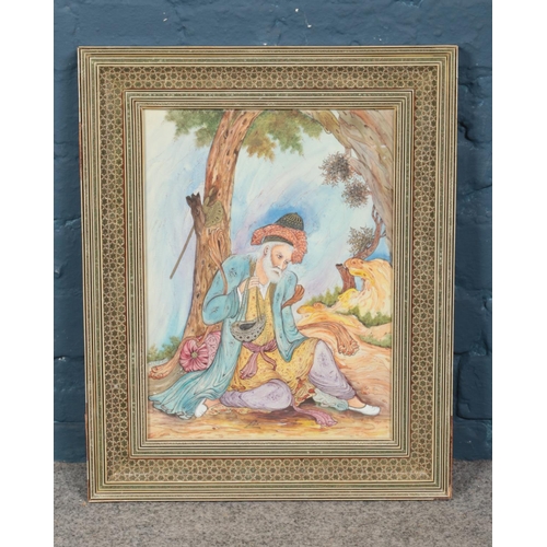 316 - A framed 20th century Eastern painting on porcelain depicting man under tree, signature indistinct. ... 