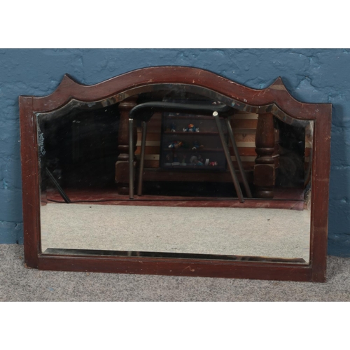 317 - An oak framed bevel edge mirror. Approx. dimensions 67.5cm x 47cm.